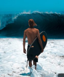 Boy,,Surfing,,Big,Ocean,Wave