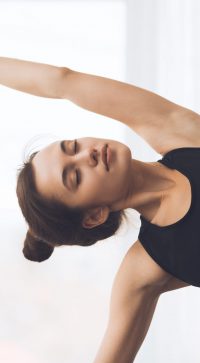 Fitness,Concept.,Relaxed,Girl,Streching,Arms,And,Practicing,Yoga,At