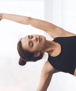 Fitness,Concept.,Relaxed,Girl,Streching,Arms,And,Practicing,Yoga,At