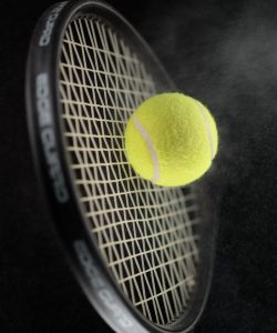 A,Shot,Of,A,Tennis,Racket,Hitting,A,Tennis,Ball.