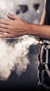 Climber,Woman,Coating,Her,Hands,In,Powder,Chalk,Magnesium,And