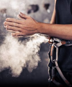 Climber,Woman,Coating,Her,Hands,In,Powder,Chalk,Magnesium,And